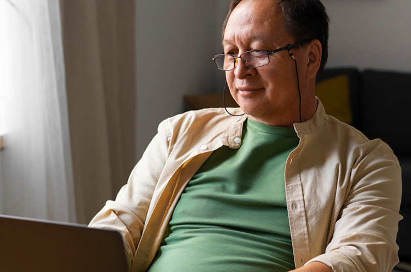 Man using a laptop to manage his policies